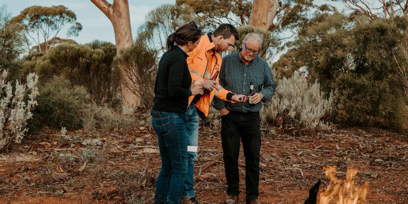 Max talking to clients in the bush