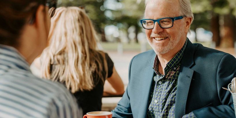 Max talking to a client in Fremantle