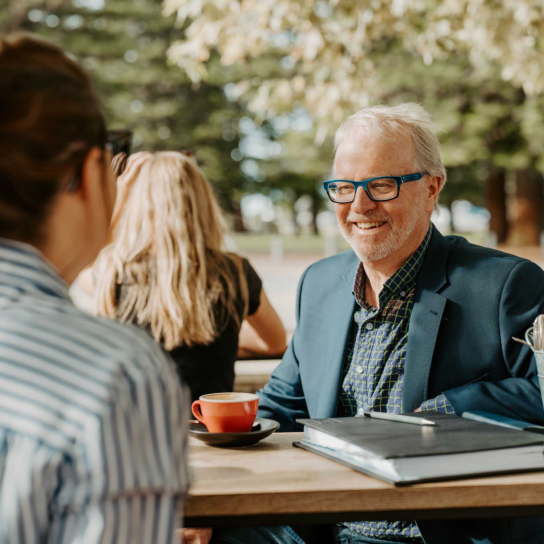 Max talking to a client in Fremantle